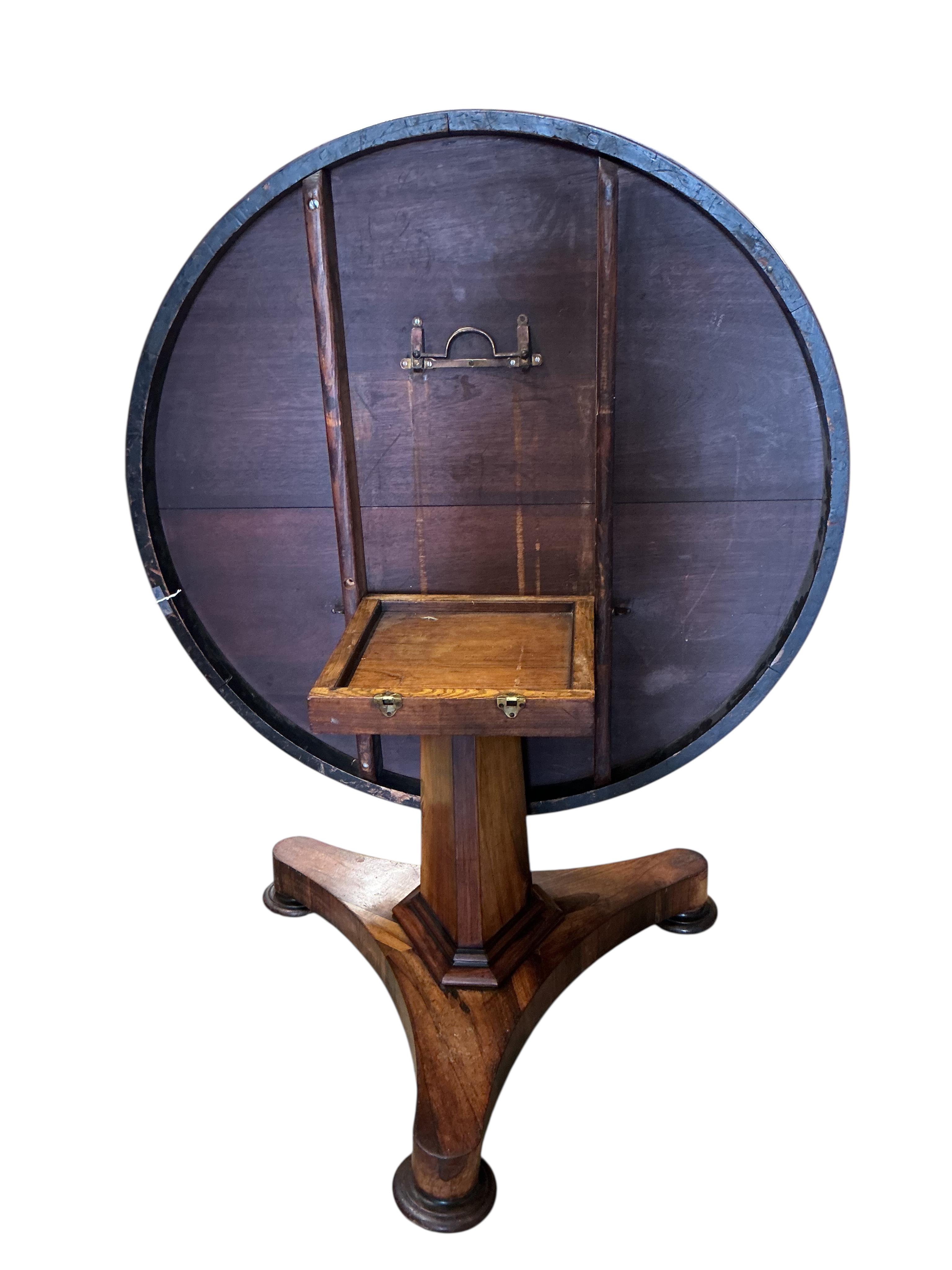An early Victorian circular rosewood tilt top breakfast table, diameter 130cm, height 74cm